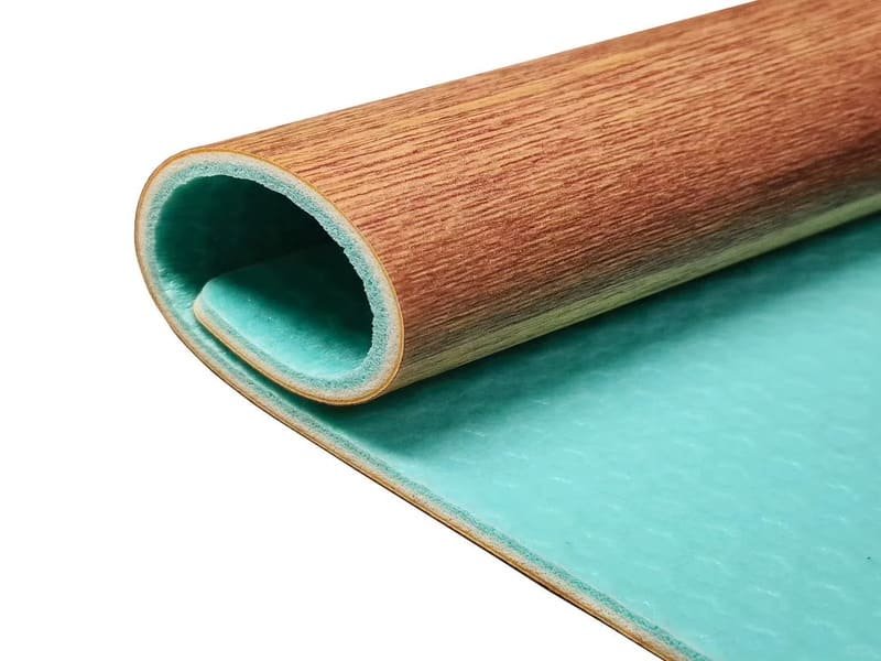 Rubber drop mats over gym flooring in weight zone